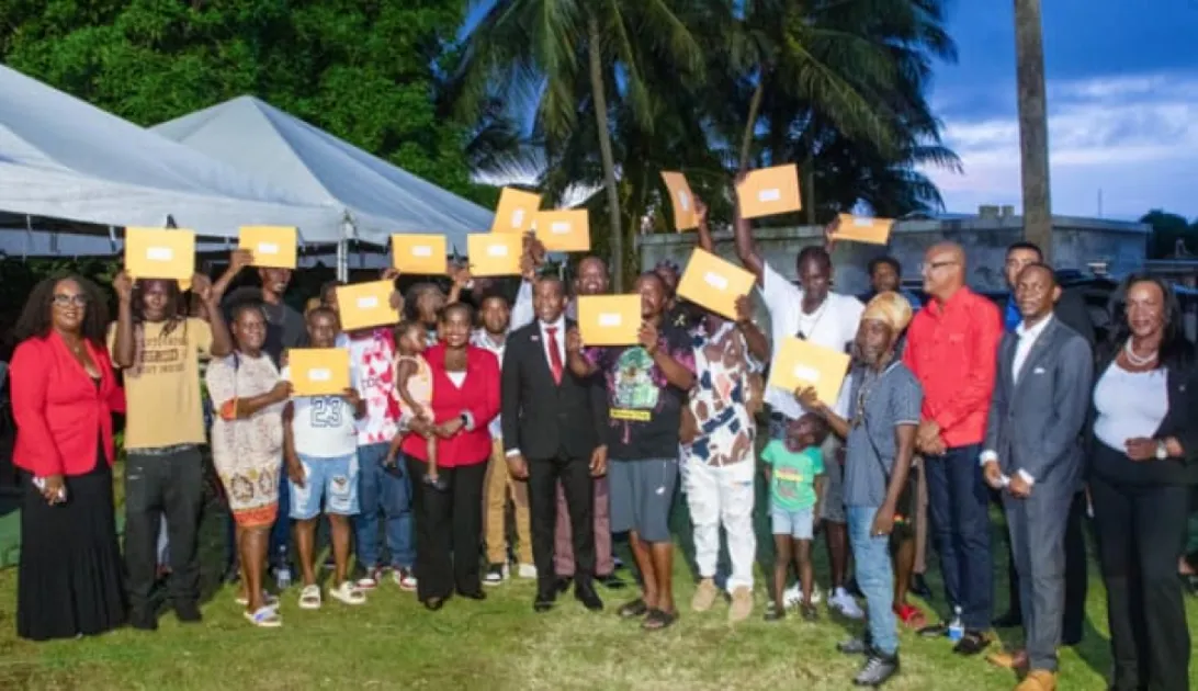 PM Drew expressed pride as families in Upper Monkey Hill, St. Peters, finally received official land titles and ownership rights after over a century of living on the land.