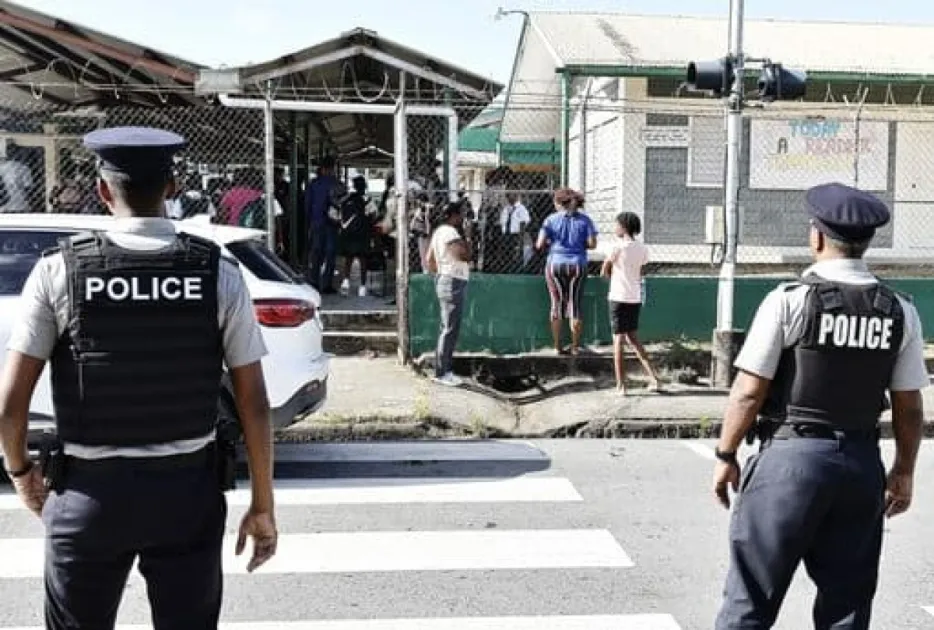 Prime Minister Kamla Persad-Bissessar says stationing officers in schools is crucial to protect students and teachers from rising classroom violence, despite opposition criticism.