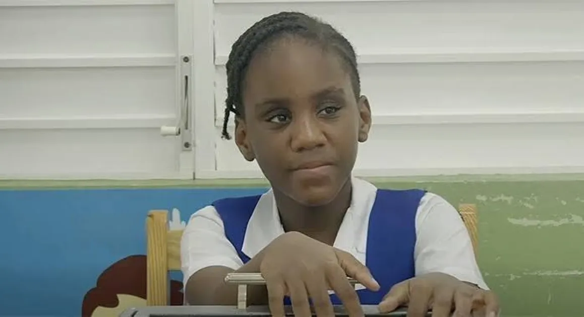 She completed the exam with assistance, including having questions read aloud and diagrams explained through touch, as part of accommodations provided during the assessment.